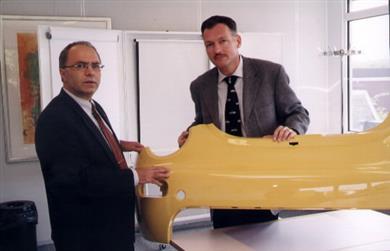 Mr. Raymond de Palma & Mr. Rob Antwerpen showing a product 