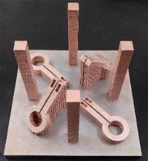 Example 3: Newly developed thin wall, pure copper pipes for induction heating (IH) coils. High-frequency induction quenching coils made of pure copper, a material that is difficult to process by precision bending or welding, are integrally formed using EBM technology. A method for forming thin wall pipes with a wall thickness as thin as 0.5 mm is currently under development.
(Photo: JAMPT Corporation, GEADPR058)