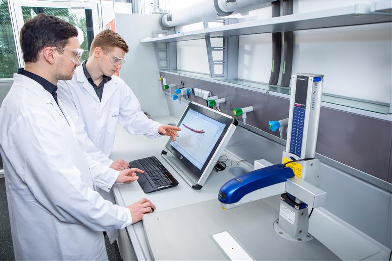 Clariant experts reviewing the results of advanced measurements to assess open time. 
