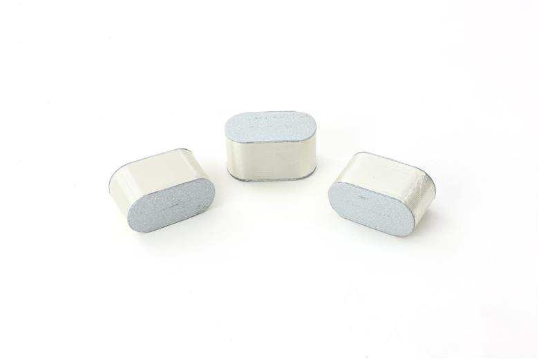 Nichicon’s high heat capacitor elements before casing and sealing (left) and capacitors (right), are made from SABIC’s ELCRES™ HTV150 dielectric film. These advanced film capacitors for AC-DC inverters can operate at high temperatures up to 150°C with minimal derating of applied voltage (V).